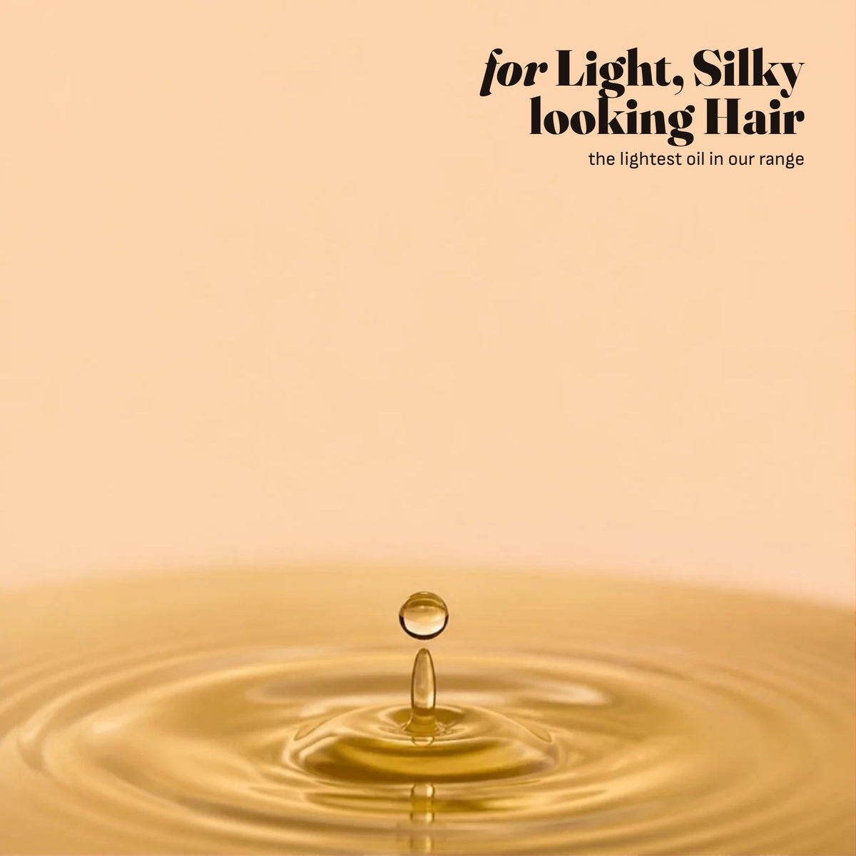 A drop of light golden jojoba oil