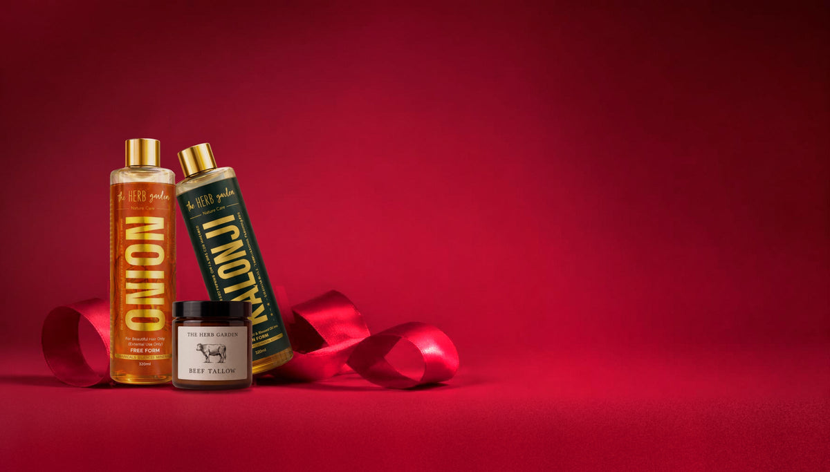 Herb Garden Onion Hair Oil, Kalonji Oil and Beef Tallow wrapped in red satin ribbon